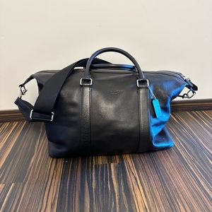 Black leather Coach duffel bag